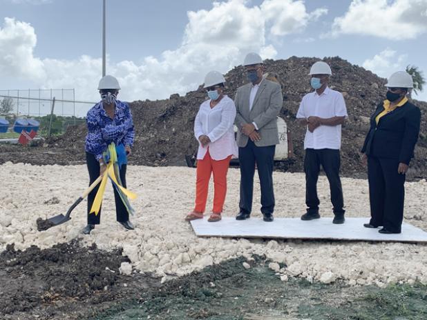 Sandra Osborne (left), President of the Barbados Olympic Association (BOA), breaking the ground for the construction as Jacqueline Gill, Executive Officer of the Tourism Development Corporation (TDC); Mark St. Hill, President of the Barbados Hockey Federation (BHF); Sir Austin Sealy, IOC member; and Yolande Howard, Permanent Secretary in the Ministry of Sports, look on.